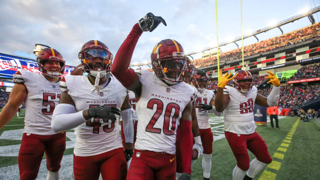 Washington Commanders cornerback Jartavius Martin (20) celebrates after an interception during the second half against the New England Patriots at Gillette Stadium.